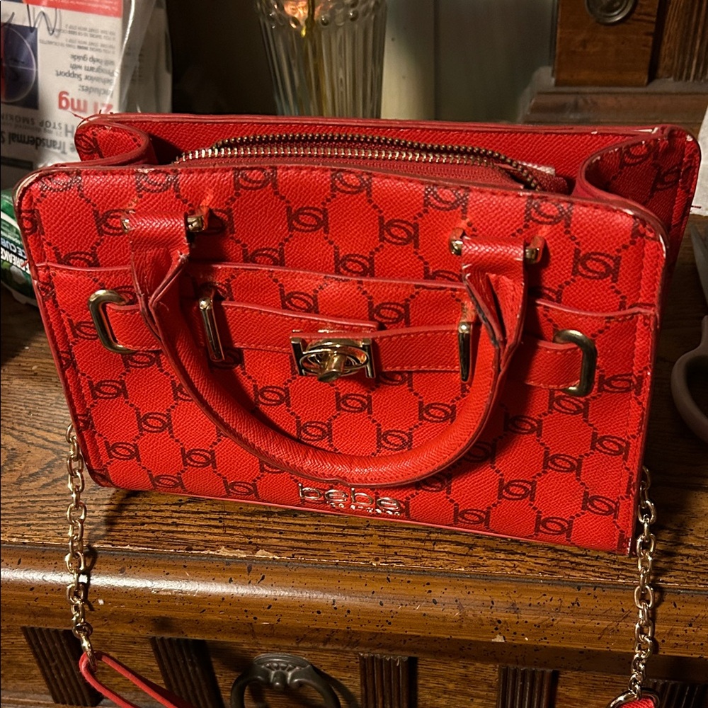 Bebe Los Angeles Bold Red purse. Has some wear to it.